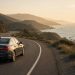 Car on a coastal highway for a long-distance trip